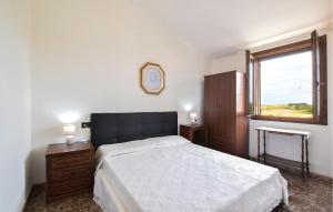 a bedroom with a large bed and a window at Casa Mario in Torre Dei Corsari