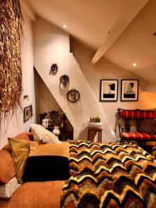 a room with a bed in a room with an attic at The Goose Garden in Hebden Bridge