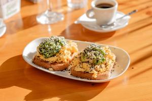 a plate with two pieces of bread with broccoli on it at Salto Hotel y Casino in Salto