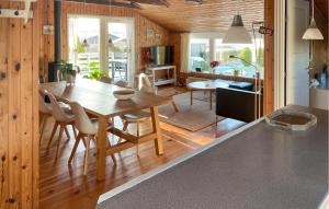 a kitchen and dining room with a table and chairs at Amazing Home In Egernsund With Wifi in Egernsund
