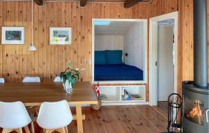a room with a table and a bed in a window at Amazing Home In Egernsund With Wifi in Egernsund