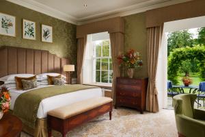 a bedroom with a large bed and a window at The K Club in Straffan +90 photos