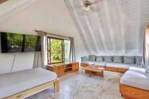 a living room with a couch and a table at Río Mar Cumayasa in La Romana