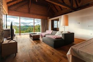a living room with a couch and a tv at Vila Podigrac in Zgornja Kungota +16 photos