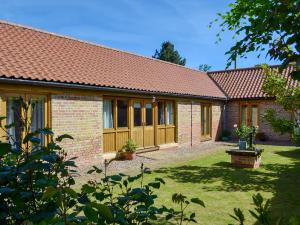 a brick house with a red roof at Cornflower Cottage Ukc1897 in Dogdyke +5 photos
