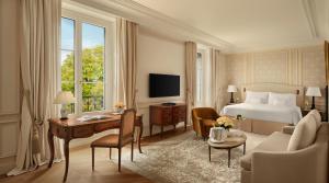 a hotel room with a bed and a desk and a couch at Beau-Rivage Genève in Geneva +85 photos