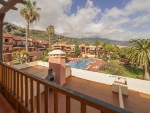 a balcony with a view of a resort at CHL La Mareta, cozy apartment with pool in Breña Baja