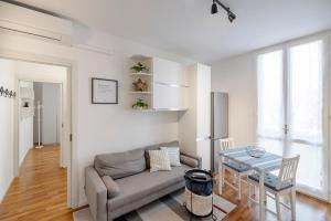 a living room with a couch and a table at Vdoppia Apartment in San Giovanni in Persiceto