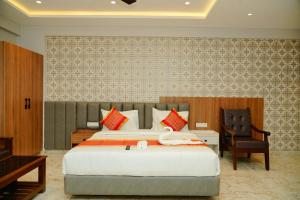 a bedroom with a large bed with a swan on it at AAryavarth suites 46 in Pālasmudram