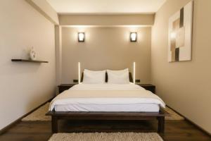 a bedroom with a bed with two pillows on it at Hanul Conitei in Sovata +54 photos