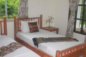 Postel nebo postele na pokoji v ubytování Privacy Resort - Koh Chang