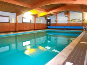 a large swimming pool with blue water at Lodge 1 - Uk51077 in Lyme Regis