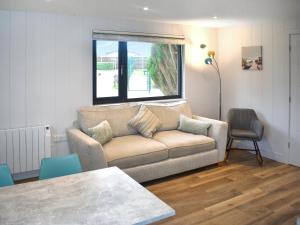 a living room with a couch and a table at Lodge 1 - Uk51077 in Lyme Regis