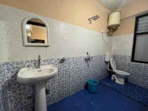 a bathroom with a sink and a toilet at Hangkhim Homestay in Ravangla