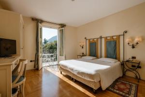 Кровать или кровати в номере Villa Sofia Hotel +45 фотографий