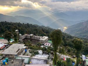 a view of a city with mountains in the background at Hangkhim Homestay in Ravangla
