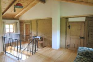 an empty room with a staircase in a house at Chalet Schmuckkastal in Kollnburg +8 photos
