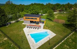 an aerial view of a house with a swimming pool at Amazing Home In Slunj in Slunj +31 photos