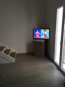 A television and/or entertainment centre at Via Roma 123