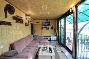 a living room with a couch and a table at Full Panorama Guest House in Aparan