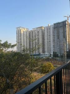 a view of tall buildings from a balcony at Altura in Bangalore