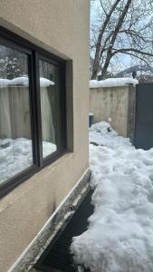 a window of a house with snow around it at pasanauri gudauri in Passanauri