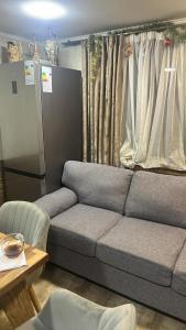 a living room with a couch and a table at pasanauri gudauri in Passanauri