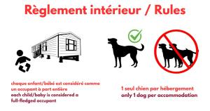 a sign that reads replacement interpretive rules with a dog at Camping Alannia El Pinar in Blanes