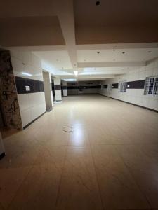 an empty gymnasium with a large room with a tile floor at ars inn and mini hall in Tiruvallam