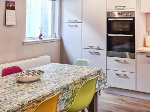 a kitchen with a table with a bowl on it at The Shore in Fortrose