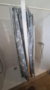 a shower in a bathroom covered in plastic at MAMRE Szálló in Hajdúböszörmény +23 photos