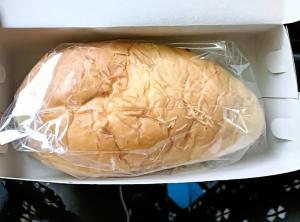 a sandwich wrapped in plastic in a box at Gandasari Homestay Banyuwangi in Dadapan