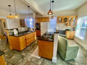 a large kitchen with wooden cabinets and a counter at The Sealy Residence in Saint John