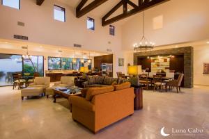 a large living room with couches and a dining room at Puerto Los Cabos Villa - Infinity Pool & Hot Tub in San José del Cabo