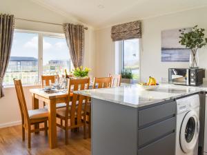 a kitchen and dining room with a table and chairs at The View - Uk36812 in Whalley
