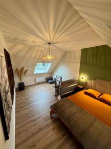 a bedroom with a large bed in a tent at L'Echappée Belle in Laguiole