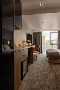 a hotel room with two beds and a fireplace at Silver Apart in Truskavets +87 photos