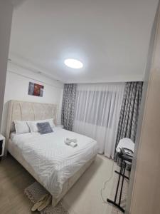 a bedroom with a bed and a desk in it at Purplehaze Place in Nairobi