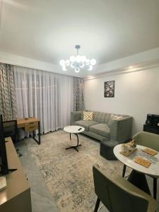 a living room with a couch and a table at Purplehaze Place in Nairobi