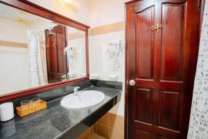 a bathroom with a sink and a mirror at Violet hotel&spa in Nha Trang +103 photos