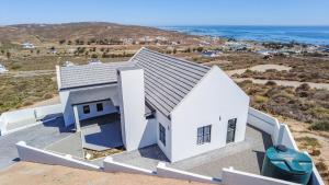 an aerial view of a white house at Cozy Cove St Helena in West Point