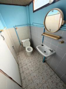 a bathroom with a toilet and a sink at TEAK HOUSE In TOWN in Mae Hong Son +20 photos