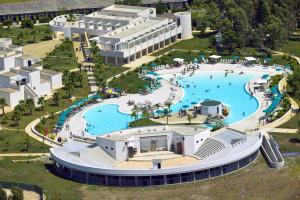 an aerial view of a pool at a resort at Fruit Village Torre dell'Orso La Brunese 4stelle in Torre dell'Orso