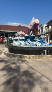 a large statue of a rat on the side of a street at Lanta natural hut garden in Ko Lanta