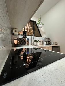 a kitchen with a black counter top in a room at Casa Jardin BV in San Antonio