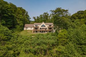 an aerial view of a large house in the woods at Mountain Paradise by Railey Vacations in Friendsville