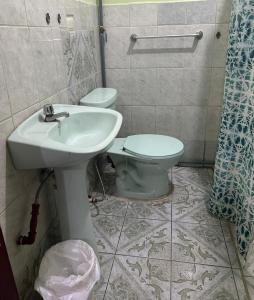 a bathroom with a sink and a toilet at Habitaciones amobladas - Manabí suites in Manta +24 photos