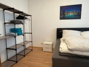 a bedroom with a bed and a book shelf at Gemütliche Unterkunft Sankt Blasien in St. Blasien