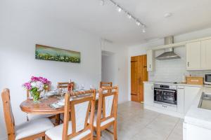 a kitchen and dining room with a table and chairs at 2 Bed in Yatton oc-s32603 in Leinthall Earls +19 photos