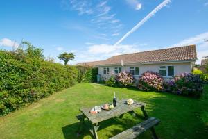 a picnic table in the yard of a house at 3 Bed in St. Merryn oc-p00114 in Saint Merryn